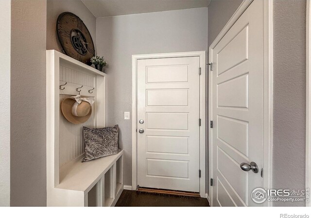 2190 Winding Dr, Longmont, CO 80504 - mudroom with dark wood-style flooring