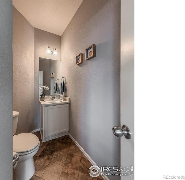 2190 Winding Dr, Longmont, CO 80504 - half bath with a textured wall and vanity