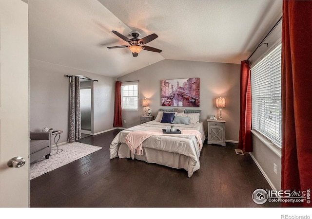 2190 Winding Dr, Longmont, CO 80504 - bedroom featuring dark wood finished floors, lofted ceiling, and a ceiling fan