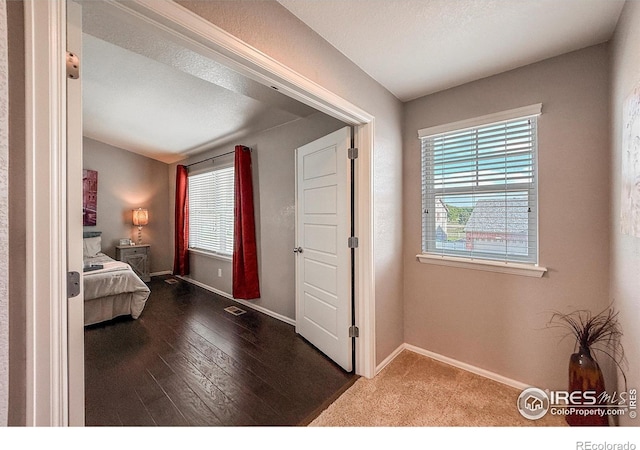 2190 Winding Dr, Longmont, CO 80504 - bedroom with multiple windows and hardwood / wood-style flooring