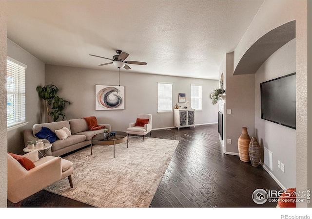 2190 Winding Dr, Longmont, CO 80504 - living room featuring dark wood-style flooring and ceiling fan