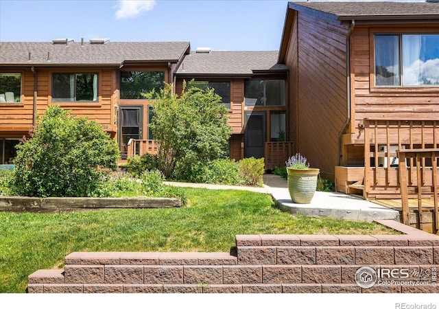 2725 Juniper Ave Unit 78, Boulder, CO 80304 - view of front of home with a shingled roof and a front lawn