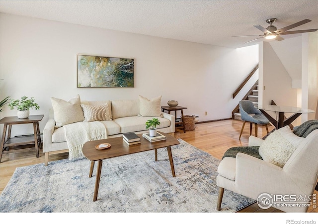 2725 Juniper Ave Unit 78, Boulder, CO 80304 - living room featuring stairway, wood finished floors, ceiling fan, and a textured ceiling
