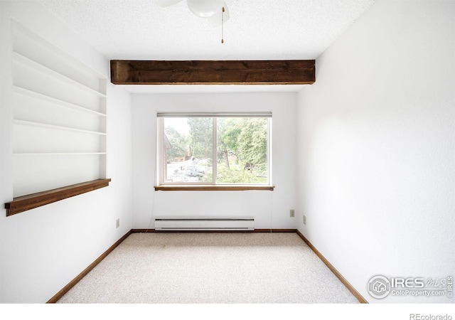 2725 Juniper Ave Unit 78, Boulder, CO 80304 - unfurnished room with baseboard heating, carpet floors, beam ceiling, baseboards, and a textured ceiling