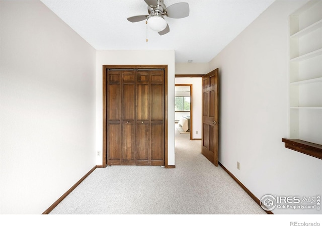 2725 Juniper Ave Unit 78, Boulder, CO 80304 - unfurnished bedroom featuring light carpet, a closet, baseboards, and ceiling fan