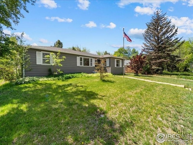 1815 9th Ave, Longmont, CO 80501 - ranch-style house with a front yard