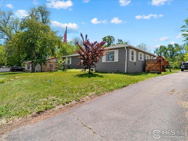 1815 9th Ave, Longmont, CO 80501 - view of front facade with a front lawn