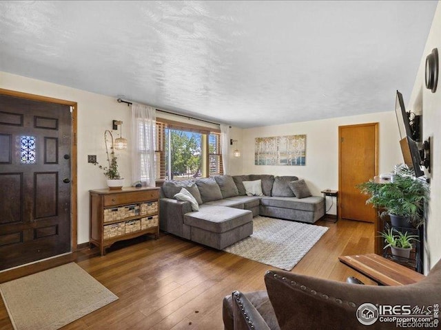 1815 9th Ave, Longmont, CO 80501 - living area with hardwood / wood-style flooring and baseboards