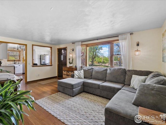 1815 9th Ave, Longmont, CO 80501 - living room with wood finished floors and baseboards