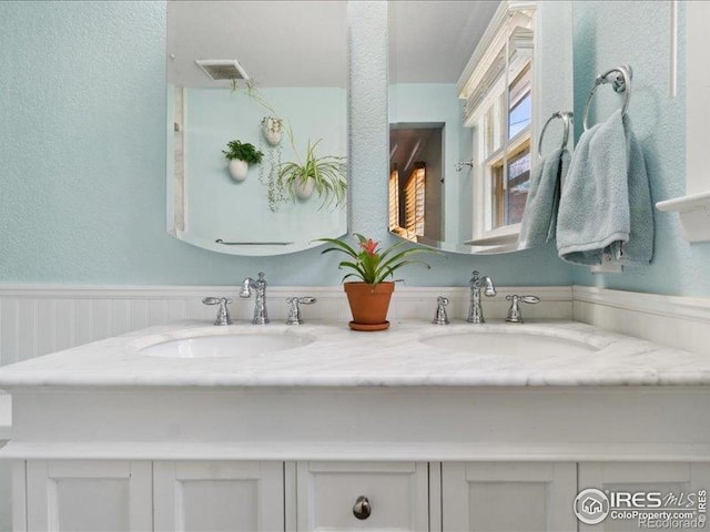 1815 9th Ave, Longmont, CO 80501 - bathroom with double vanity and a textured wall
