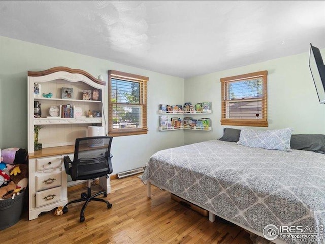 1815 9th Ave, Longmont, CO 80501 - bedroom featuring multiple windows and wood finished floors
