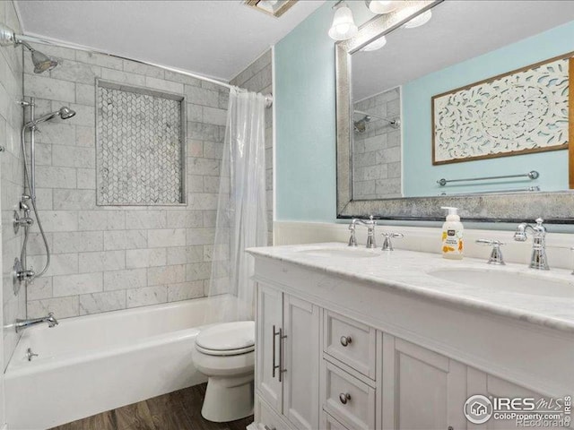 1815 9th Ave, Longmont, CO 80501 - full bath with wood finished floors, shower / bath combo, toilet, and double vanity