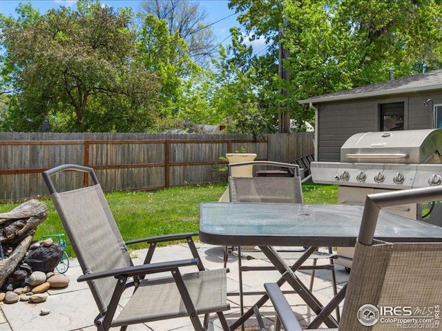 1815 9th Ave, Longmont, CO 80501 - fenced backyard featuring a patio area and outdoor dining space
