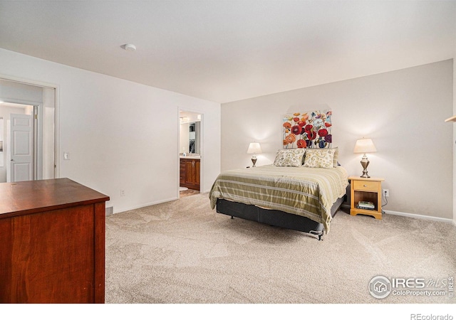 1119 Oakmont Ct, Fort Collins, CO 80525 - bedroom featuring light colored carpet, baseboards, and ensuite bath