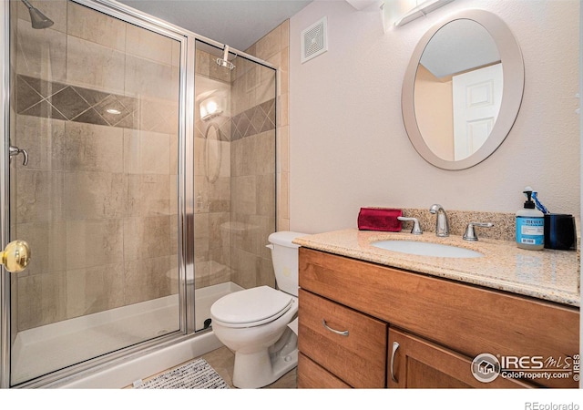 1119 Oakmont Ct, Fort Collins, CO 80525 - full bathroom featuring a shower stall, vanity, and toilet