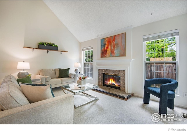 911 Homer Cir, Lafayette, CO 80026 - living area featuring carpet floors, a premium fireplace, lofted ceiling, and a textured ceiling