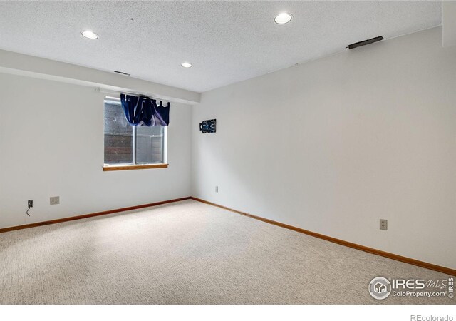911 Homer Cir, Lafayette, CO 80026 - carpeted empty room featuring recessed lighting, a textured ceiling, and baseboards