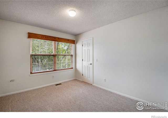 911 Homer Cir, Lafayette, CO 80026 - unfurnished room with carpet, a textured ceiling, and baseboards