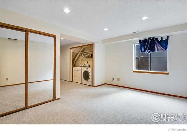 911 Homer Cir, Lafayette, CO 80026 - below grade area featuring carpet, washing machine and clothes dryer, recessed lighting, baseboards, and a textured ceiling