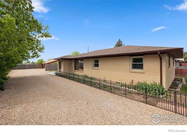 1217 N US Highway 287, Fort Collins, CO 80524 - view of front of house featuring brick siding and a shingled roof