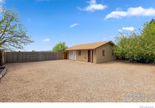1217 N US Highway 287, Fort Collins, CO 80524 - back of house featuring a detached garage and an outdoor structure