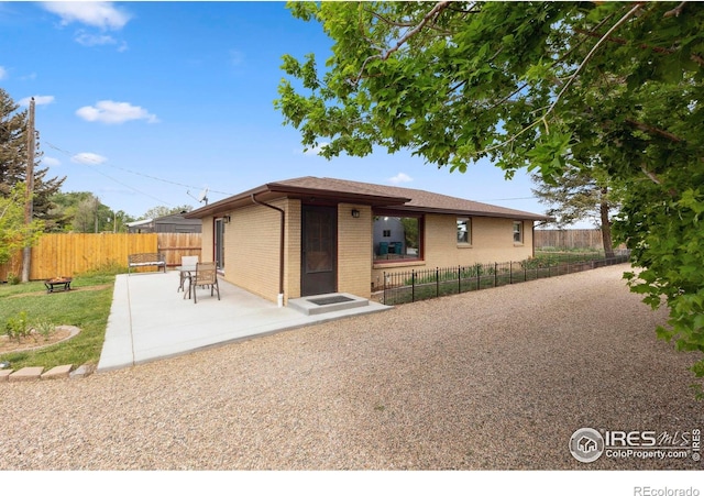 1217 N US Highway 287, Fort Collins, CO 80524 - view of front of house featuring brick siding and a patio