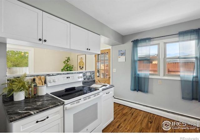1217 N US Highway 287, Fort Collins, CO 80524 - kitchen featuring electric range, a baseboard heating unit, dark wood-style flooring, white cabinets, and dark stone countertops
