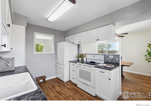 1217 N US Highway 287, Fort Collins, CO 80524 - kitchen featuring white appliances, a sink, dark countertops, and white cabinets