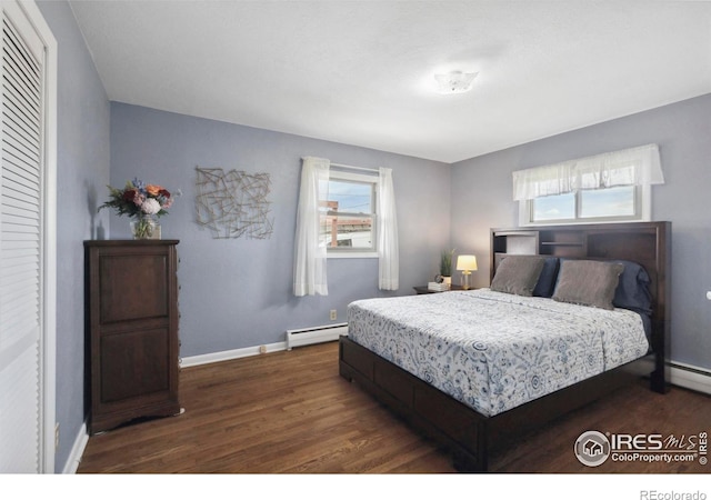 1217 N US Highway 287, Fort Collins, CO 80524 - bedroom with baseboard heating, dark wood finished floors, and baseboards