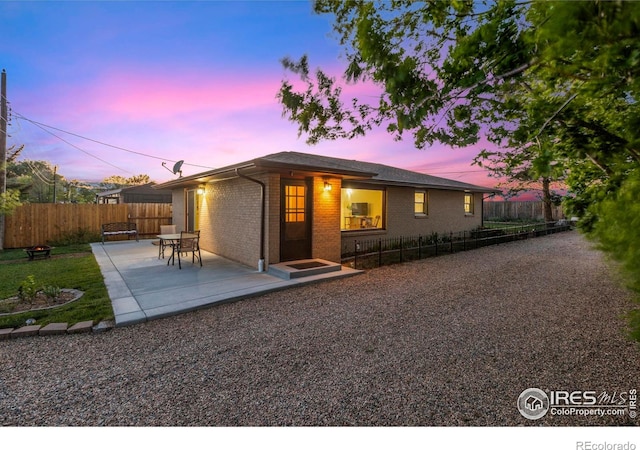 1217 N US Highway 287, Fort Collins, CO 80524 - back of property with brick siding and a patio area