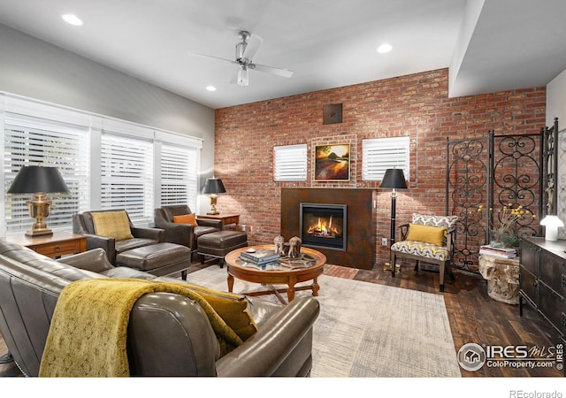 317 Wood St, Fort Collins, CO 80521 - living area featuring a ceiling fan, hardwood / wood-style flooring, a glass covered fireplace, brick wall, and recessed lighting