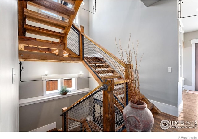 317 Wood St, Fort Collins, CO 80521 - stairs with wood finished floors and baseboards