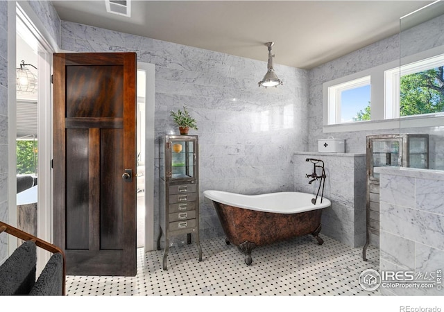 317 Wood St, Fort Collins, CO 80521 - full bathroom with a freestanding tub and tile walls