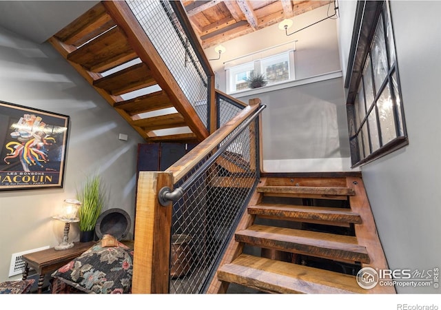 317 Wood St, Fort Collins, CO 80521 - stairway featuring beamed ceiling
