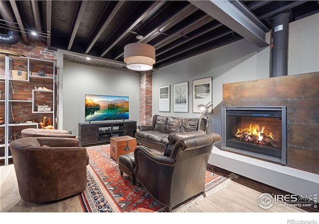 317 Wood St, Fort Collins, CO 80521 - living room featuring wood finished floors and a lit fireplace