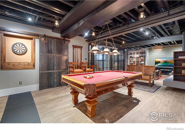 317 Wood St, Fort Collins, CO 80521 - game room with a barn door, wood finished floors, billiards table, and baseboards