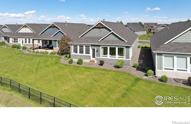 1948 Tidewater Ln, Windsor, CO 80550 - view of front of house featuring stone siding, a patio area, entry steps, and board and batten siding
