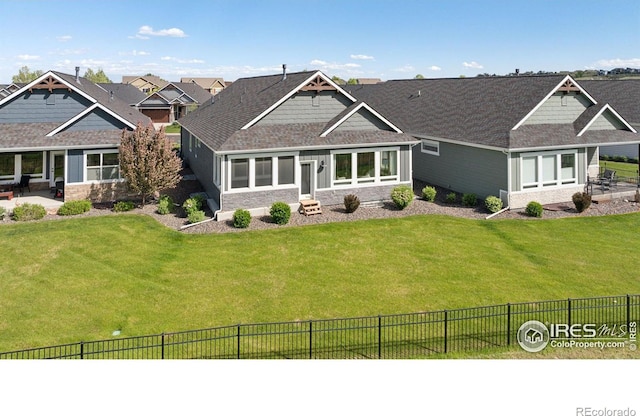 1948 Tidewater Ln, Windsor, CO 80550 - craftsman inspired home with a patio, stone siding, and roof with shingles