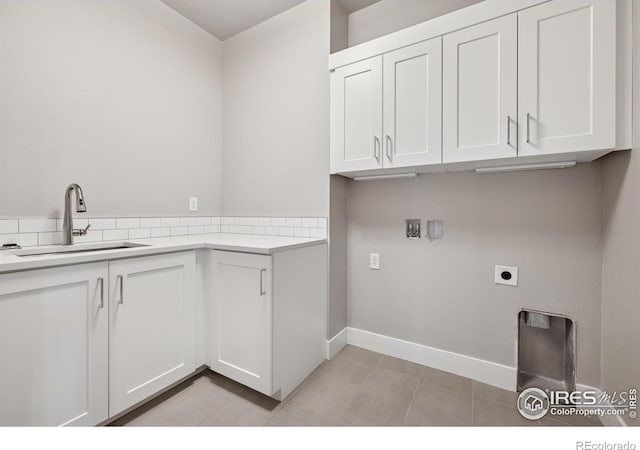 1948 Tidewater Ln, Windsor, CO 80550 - washroom with cabinet space, baseboards, hookup for a washing machine, and hookup for an electric dryer