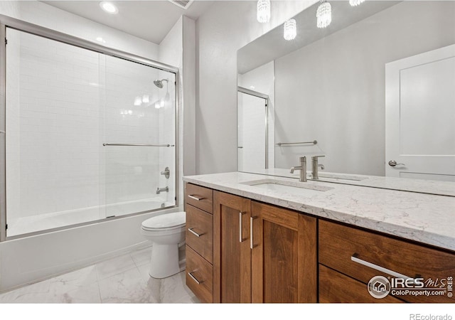1948 Tidewater Ln, Windsor, CO 80550 - bathroom featuring marble finish floors, toilet, vanity, bath / shower combo with glass door, and recessed lighting