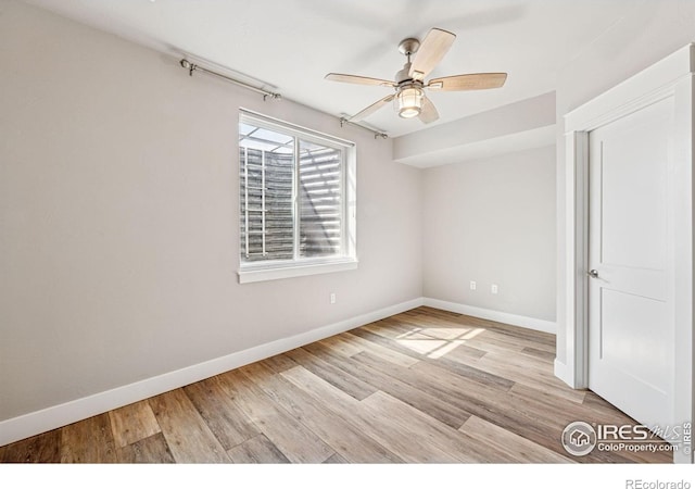 1948 Tidewater Ln, Windsor, CO 80550 - unfurnished room featuring baseboards, wood finished floors, and ceiling fan