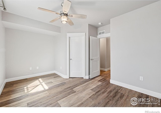 1948 Tidewater Ln, Windsor, CO 80550 - unfurnished bedroom with wood finished floors and baseboards
