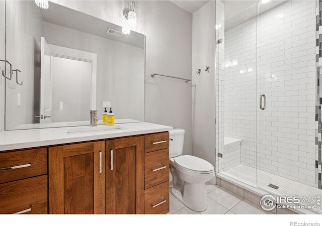1948 Tidewater Ln, Windsor, CO 80550 - full bathroom with a stall shower, tile patterned floors, toilet, and vanity
