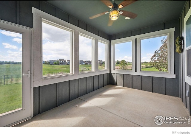 1948 Tidewater Ln, Windsor, CO 80550 - unfurnished sunroom featuring ceiling fan, plenty of natural light, and carpet