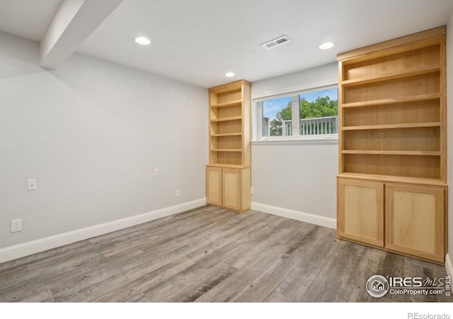 518 Whitmore Ct, Johnstown, CO 80534 - spare room with wood finished floors, baseboards, and recessed lighting