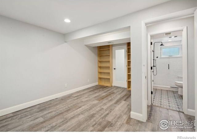 518 Whitmore Ct, Johnstown, CO 80534 - basement featuring wood finished floors, baseboards, and recessed lighting