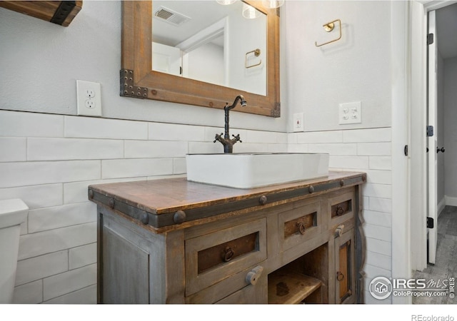 518 Whitmore Ct, Johnstown, CO 80534 - bathroom with tile walls and vanity