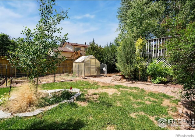 518 Whitmore Ct, Johnstown, CO 80534 - view of yard with a greenhouse and an outbuilding