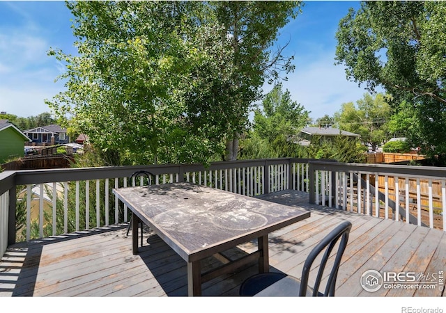 518 Whitmore Ct, Johnstown, CO 80534 - wooden terrace featuring outdoor dining area