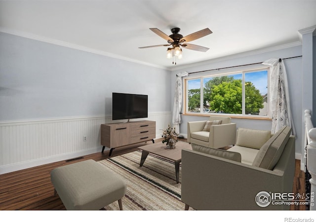 518 Whitmore Ct, Johnstown, CO 80534 - living area featuring wainscoting, ceiling fan, wood finished floors, and crown molding